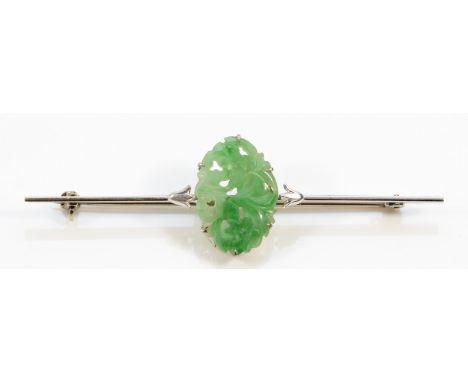 A 9ct white gold floral carved jade Art Deco brooch, 65mm across, 6g