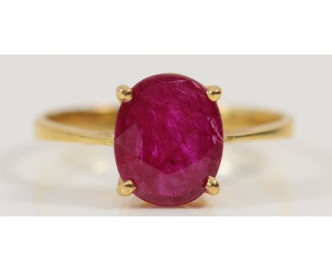 An 18ct gold ruby solitaire ring, hallmarks have been polished away, calculated 3.3ct ruby, 10mm x 8mm x 3mm ruby, P 1/2, 3.2