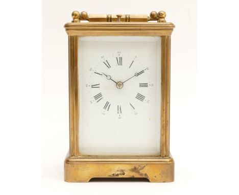 L'Epee; An early 20th Century brass carriage clock, with an enamel dial featuring Roman Numerals, a French eight day movement