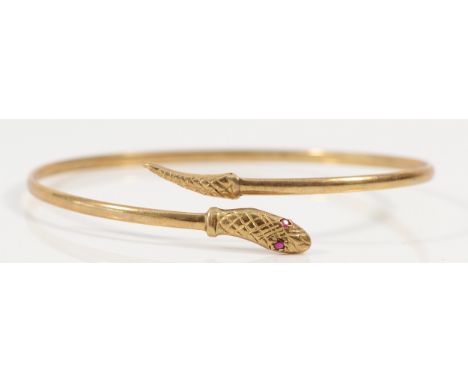 A 9ct rolled gold ruby eyed snake bracelet, Birmingham 1986, 68mm diameter, 4.6g