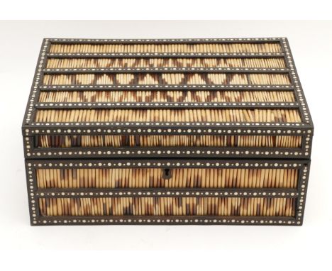 A mid 20th century Anglo-Indian ivorine and porcupine rectangular quill box, with fitted interior compartments, 32x23cm.