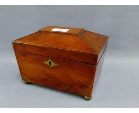 19th century mahogany sarcophagus shaped tea caddy box with a hinged lid, void interior with brass escutcheon and four brass 
