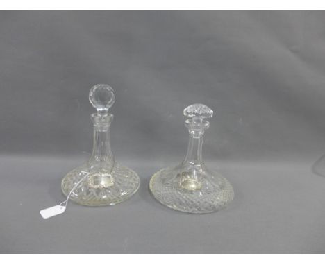 Two ships decanters with stoppers, both with silver decanter labels, one inscribed 'Sherry' the other 'Whisky', (4) 