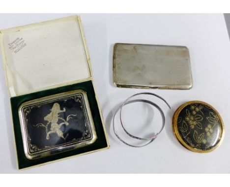 Mixed lot to include a Thai white metal and niello cigarette case and another, white metal snake bangle and a vintage powder 