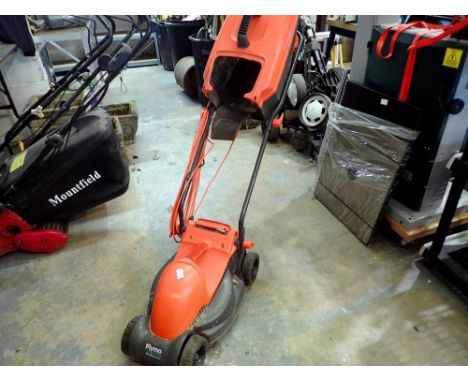 FlyMo Rollermo lawnmower with box. All electrical items in this lot have been PAT tested for safety and have passed. This doe
