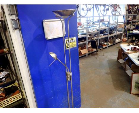 Free standing combination uplighter and reading lamp, in brushed steel. All electrical items in this lot have been PAT tested