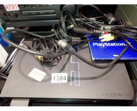 PlayStation 2 console and cables. All electrical items in this lot have been PAT tested for safety and have passed. This does