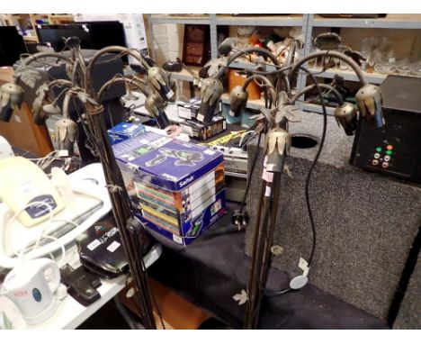 Loxon LO26 room lamps on metal base stands with decorative leaves. (2), H: 149 cm. All electrical items in this lot have been