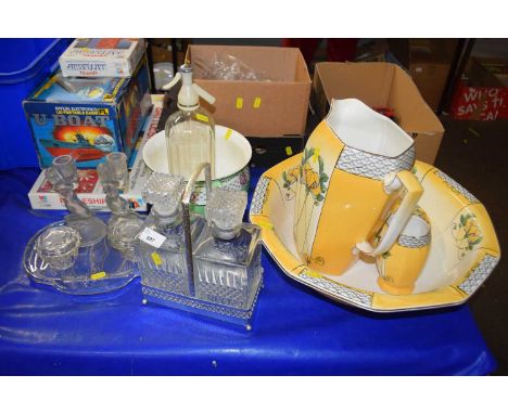 Assortment of glass ware and ceramics to include two bottle tantalus, chamber pot, glass ware, wash bowl set including jug, s