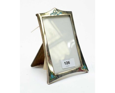 A silver and enamel photograph frame, by James Walter Tiptaft, Birmingham 1925, with bow and flower design, 14cms high. 