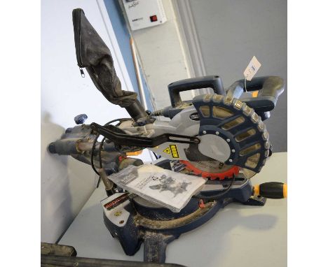 A Macallister 1400W 210mm slide compound mitre saw, with operating manual.