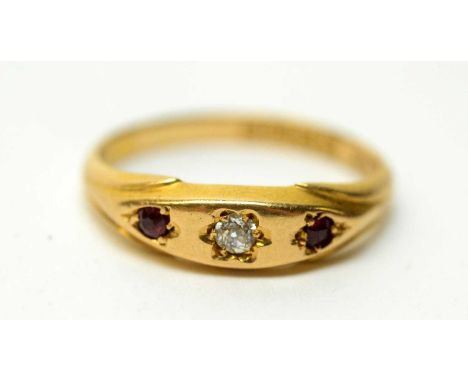 A ruby and diamond ring, the central old-cut diamond in star pattern setting flanked by two rubies, on 18ct yellow gold shank