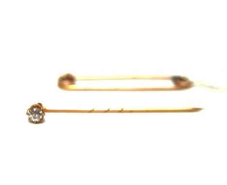 A diamond stock/tie pin, the old cut diamond weighing approximately 0.35 carat, in yellow metal mount; and a yellow metal saf