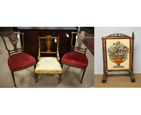 A pair of Edwardian inlaid mahogany hall chairs, each with marquetry inlaid and banded pierced splats, with later red upholst