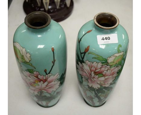 A pair of Japanese cloisonne enamel vases, each decorated with pink flowers and foliage, on an aqua ground, 14cms high.