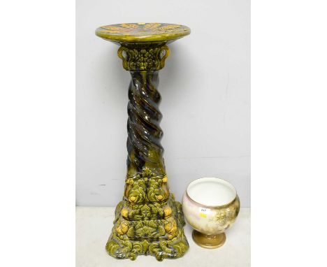 A 20th Century Majolica jardiniere stand, 72cms high; together with a German/Polish planter, raised on a circular foot, the b