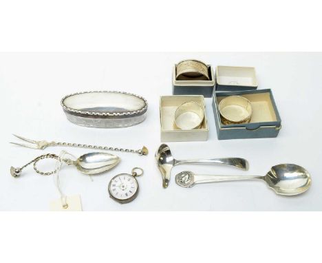 A selection of silver items, including: napkin rings; a Cattle Breeder's prize spoon; a pickle fork, a sauce ladle; a fob wat