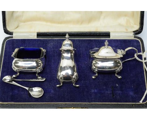 A three piece silver cruet set, by Nothern Goldsmiths, Birmingham 1923, with engraved initial 'R', cased. 