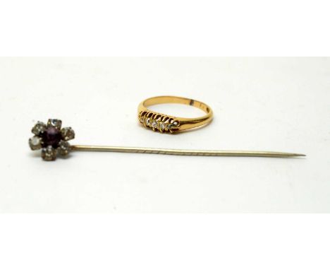 A five stone diamond ring, the graduated old-cut diamonds on gold shank (marks rubbed), ring size K, 2.3g gross; and a tie pi