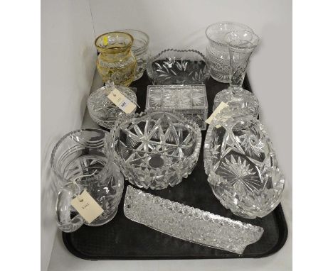 A selection of pressed and cut glassware, including bowls, vases, lidded trinket box and other items, two trays. 