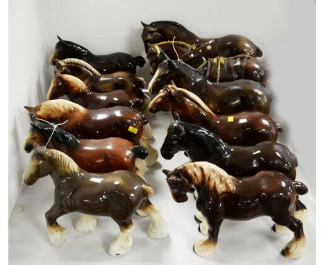 A selection of ceramic figures of horses, of various sizes, designs and makers, most unmarked, the tallest approximately 29cm