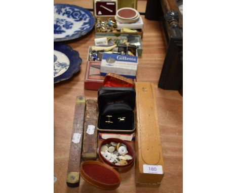 A great selection of curios and trinkets including razors, playing cards, enamel pin badges and cuff links.