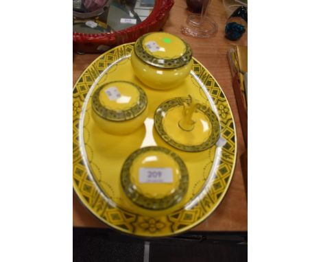 An early 20th century Burleigh ware dressing table set in a yellow and black pattern.