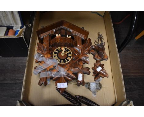 A vintage mid century coo coo or Cuckoo clock having a carved Black Forrest design with couples dancing.