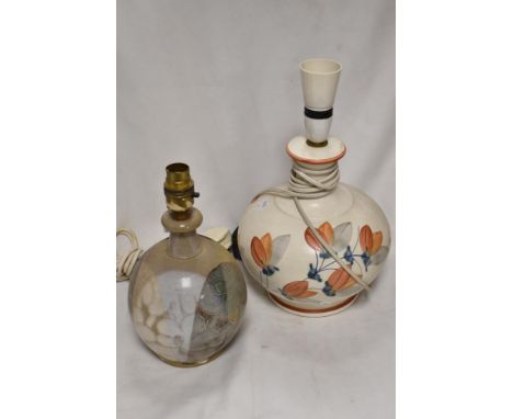 Two vintage studio pottery lamp bases including a hand painted floral base and similar Denby style base.
