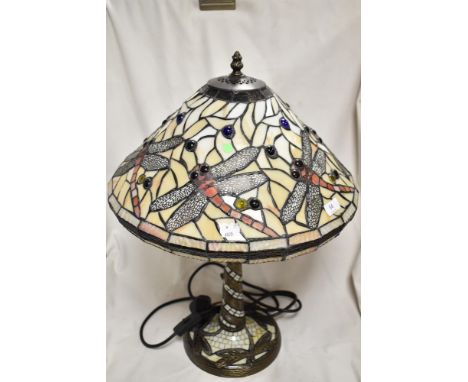 A modern Tiffany styled leaded light lamp, having a dragon fly shade design and base.