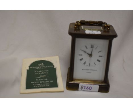 A 20th century Matthew Norman brass cased carriage clock, visible platform escapement eleven jewels and Swiss made, recently 