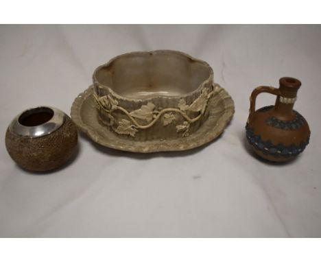 A small Doulton Silicone jug, a HM silver rim vesta striker and a Victorian marbled ceramic butter dish with ivy leaf design.