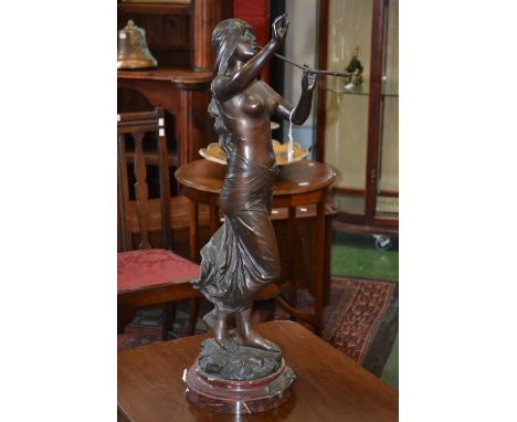 Edouard Drouot (1859-1945), after, a brown patinated bronze, Muse des bois Pan Drouot, the classical muse stands playing pan 