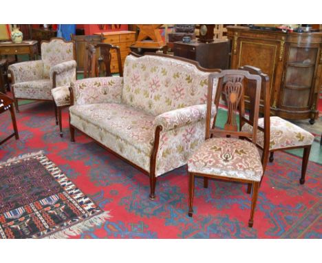 A late Victorian mahogany and marquetry six piece salon suite, comprising a sofa, an armchair and four dining chairs, c.1900