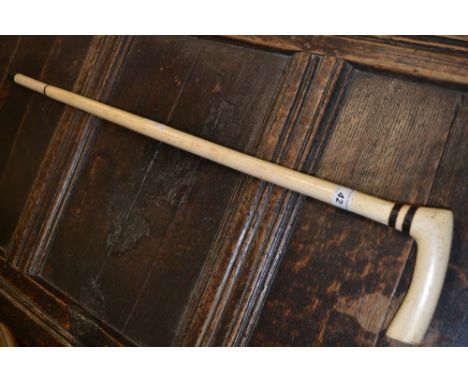 A George III whale bone walking stick, plain handle, 78cm long