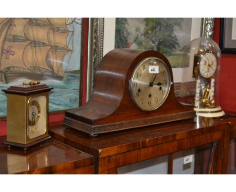 A Napoleon oak mantle clock; an anniversary clock; a carriage clock (3)