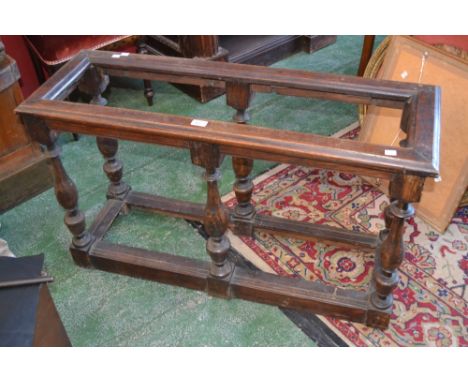A long oak stick stand, baluster turned supports