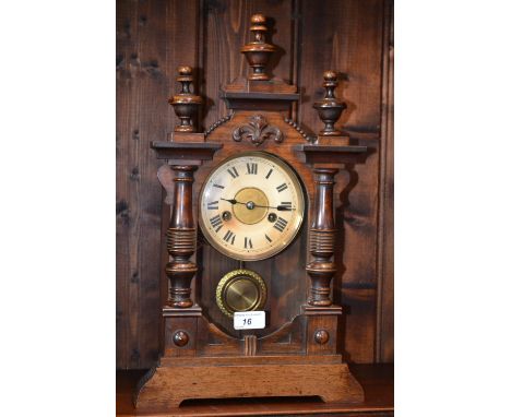 An Edwardian HAC clock Co. mantel clock, turned finials, cream dial, Arabic numerals, eight day movement. 