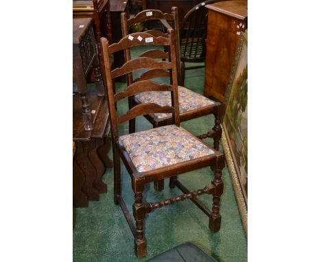 Two ladder back dining chairs and a contemporary footstool. (3)