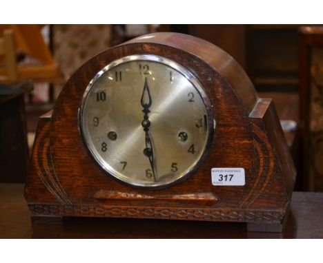 An Art Deco oak cased Westminster chiming mantle clock