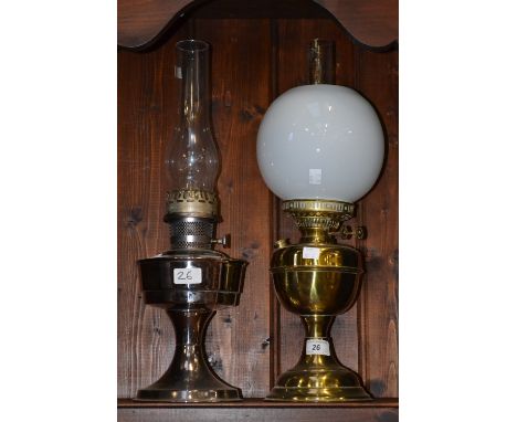A brass oil lamp; Duplex twin burner, opaque glass shade; an Aladdin chrome oil lamp (2)