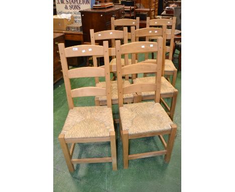 Six rush seated ladder back kitchen chairs