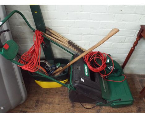Axe, chopper, qty of vices, lawn spreader, Qualcast electric scarifier, Qualcast electric hedge trimmer, drain rods etc. 