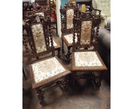 Set of four Victorian carved oak barley twist framed dining chairs with tapestry upholstered seats and back pads 