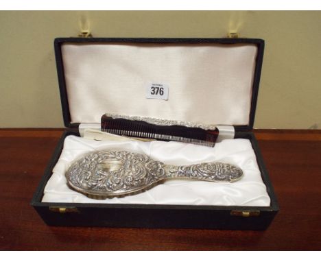 Hallmarked silver highly embossed brush and comb set in presentation box 