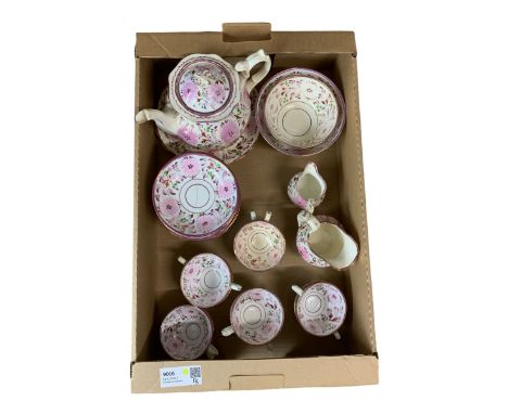 19th century pink lustre tea set comprising ten cups, twelve saucers, teapot, two jugs, two bowls and a plate