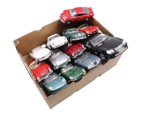Box with 11 scale model cars and 1 battery-powered plastic car