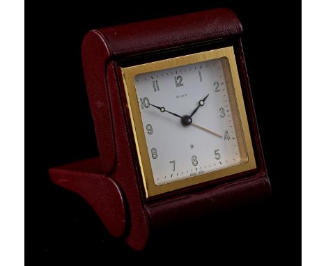 Elka Swiss travel alarm clock in a red leather case, 1960s, 9.5x6.5 cm