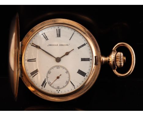 Zenith men's vest pocket watch in a gold case with waffled decor and decorated with Russian inscription, timepiece is numbere