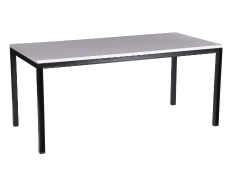 Minimalist dining room table with white laminated top and blackened metal legs, design Janni van Pelt, executed by Bas van Pe